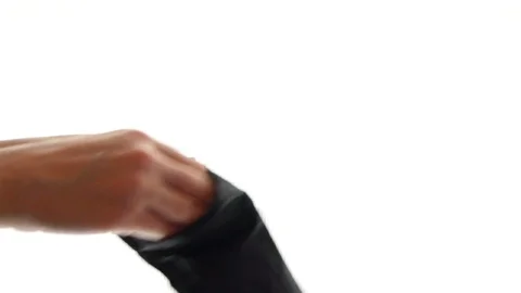 Putting on protective latex gloves, hands wear rubber black gloves on a white Stock Footage 127313662