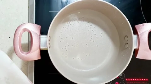 Putting ramen in a pot Stock Footage 205344550