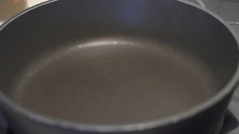Putting a raw rib eye beefsteak to a hot smoking frying pan Video stock 111512389