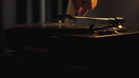 Putting a record on a platter and playing on vacation, listening to music. Stock Footage 186944026