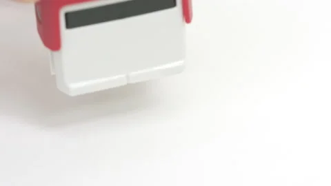 Putting red CANCELLED rubber stamp on the paper, close-up shot Stock Footage 144278949