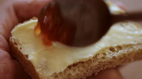 Putting red caviar on bread with butter Stock Footage 133339716