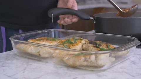 Putting Red Sauce on Chicken Stock-Footage 97730707