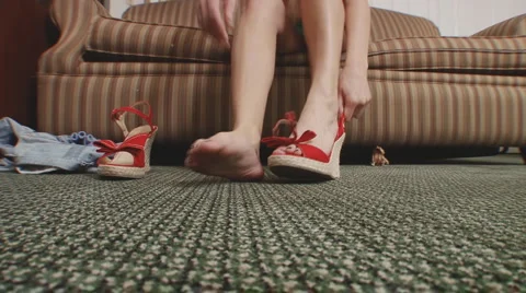 Putting on red shoes Stock-Footage 3175132