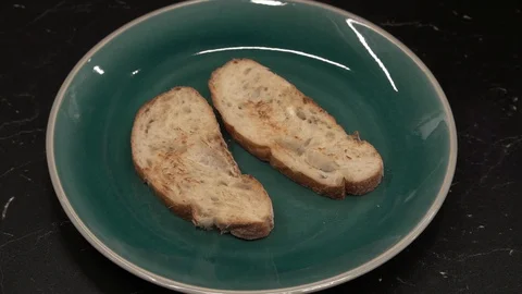 Putting ricotta and figs on bread above view Stock Footage 113528457