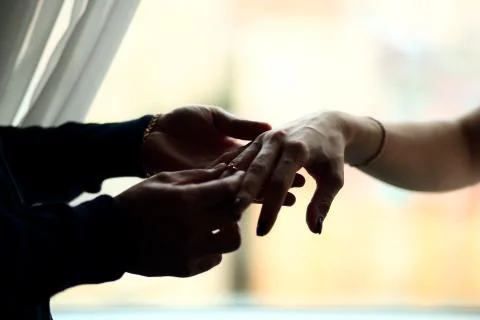 Putting on the ring Stock Photos