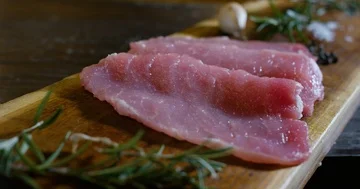 Putting row meat on a chopping board 4k Stock Footage 85836023