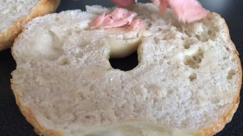 Putting Salmon onto Sandwich Closeup 스톡 동영상 76580482
