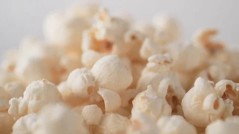 Putting salt over popcorn. Slow Motion. Stock Footage 82189583