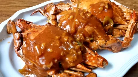 Putting Sauce on Cooked Crab Stock Footage 149408058