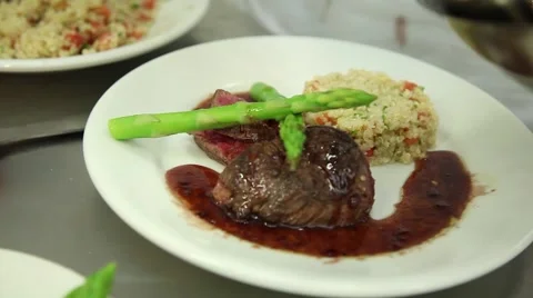 Putting sauce into a finalized dish Stock Footage 46531694