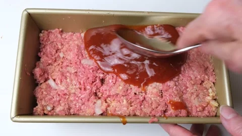 Putting sauce on meatloaf Stock Footage 219492832