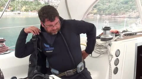 Putting scuba on Stock Footage 12189740