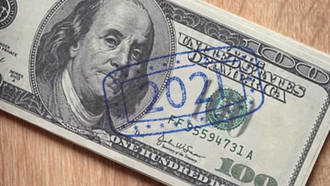 Putting seal on hundred dollar bill Stock Footage 140608279