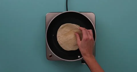 Putting on a second tortilla 1 Stock Footage 132203773
