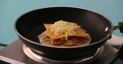 Putting on a second tortilla 2 Stock-Footage 132203780