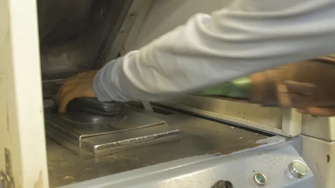 Putting a shoe in a machine Stock Footage 108843556