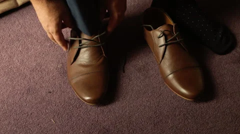 Putting on Shoes - Wide shot Stock Footage 59198611