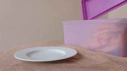 Putting a slice of bread into a white plate Stock Footage 146256543