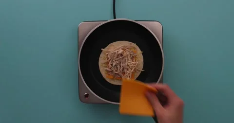 Putting a slice of cheese on chicken, sliced cheese, shredded cheese and a t Stock-Footage 132203678