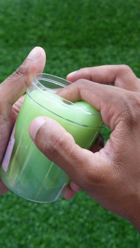 Putting Slime Back Into A Container By Hand, First Person POV Video stock 345951396