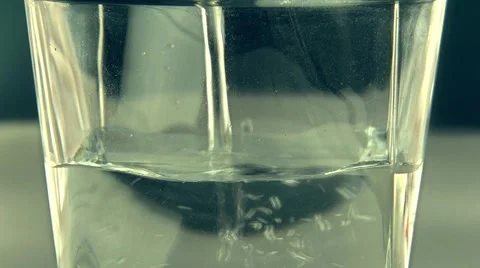 Putting some water in glass Stock Footage 68374953