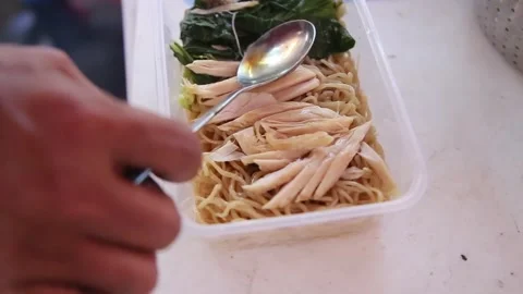 Putting soy sauce and spring onions on noodles Stock Footage 272298452
