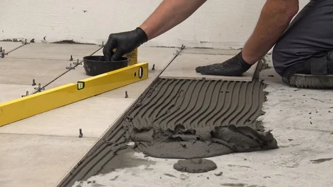 Putting spacers between tiles Stock Footage 111866727