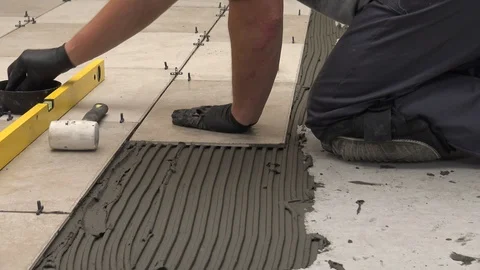 Putting spacers between the tiles Stock Footage 111866753