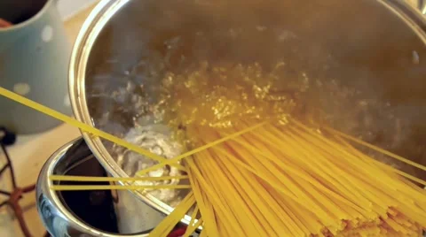 Putting spaghetti into the boiling water Stock Footage 50311159