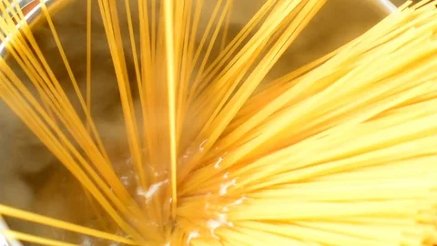 Putting spaghetti into the boiling water Stock Footage 73140833