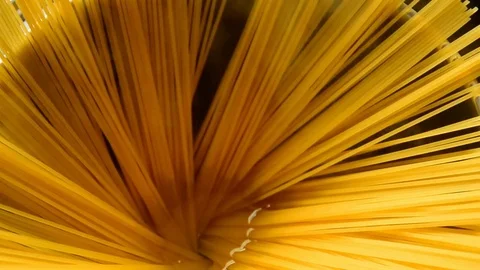 Putting spaghetti into the boiling water. Stock Footage 74491743