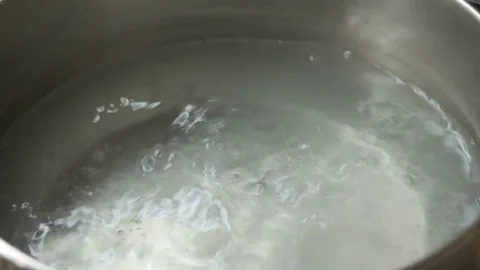 Putting spaghetti into the boiling water Stock Footage 82318385