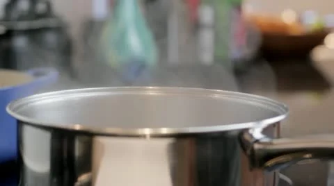 Putting spaghetti into pan Video stock 12726865