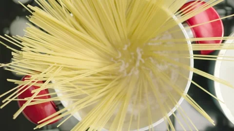 Putting Spaghetti Pasta into Pan with Boiling Water 4K 動画素材 344052347