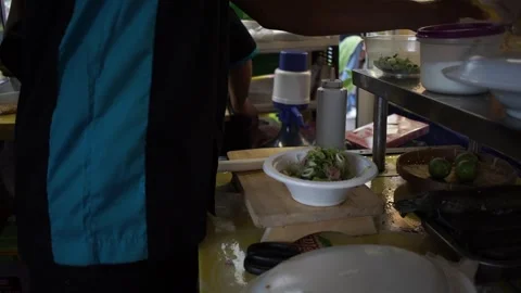 Putting spring onions and fried shallots into a plastic white bowl 스톡 동영상 268515888