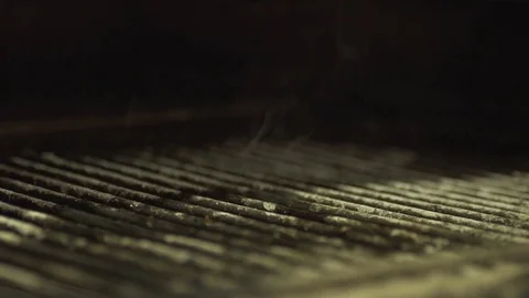 Putting steak on a grill slow-mo Stock Footage 69781631