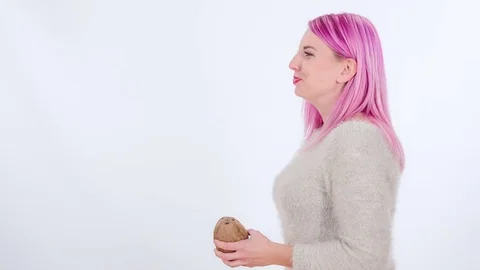 Putting a straw into a coconut Stock Footage 83724543
