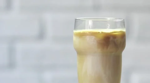 Putting straw into the ice latte, slow motion Vídeos de archivo 67902994