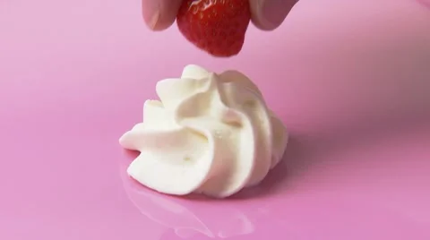 Putting a strawberry on a cream rosette Stock Footage 8572229
