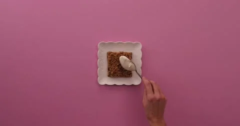 Putting stuff on apple crumble piece 1 Stock Footage 132209038