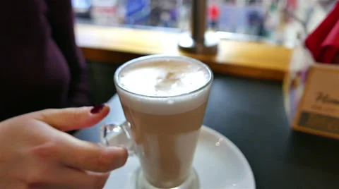 Putting Sugar in Latte Cofee at Cafe Stock Footage 58483636