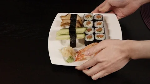 Putting sushi on table Stock Footage 89663707