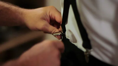 Putting On Suspenders Stock Footage 35824881