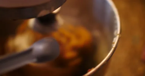 Putting a teaspoon of baking powder into cookie batter and mixer Video stock 217356361