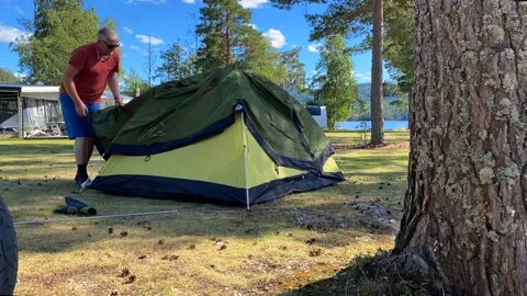 Putting up a tent Stock Footage 220021354