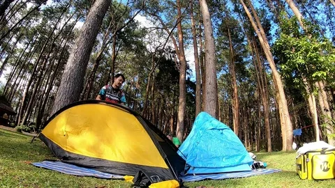 Putting tents at campground Stock Footage 108134022