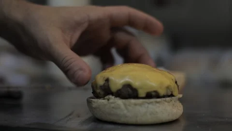 Putting together a Cheeseburger with Mayo Stock Footage 129049024