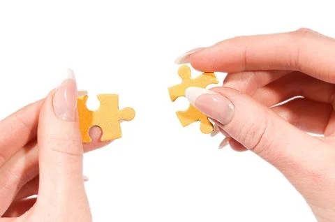 Putting together right puzzle Foto stock