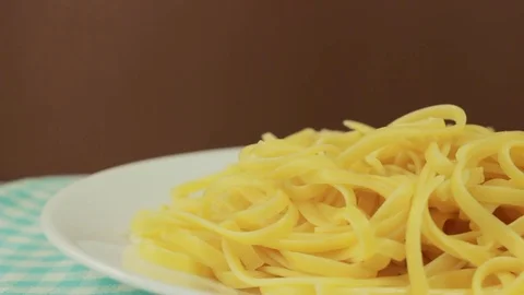 Putting tomato sauce on spaghetti Stock Footage 73968617
